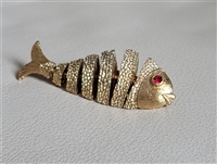 Vintage 60s articulated fish brooch gold tone jewelry with red rhinestone eye Vintage 60s articulated fish brooch gold tone jewelry with red rhinestone eye