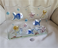1990s Italian rectangular nautical art glass tealight candle holder with wavy top featuring applied blue fish yellow octopuses pink starfish and red coral 1990s Italian rectangular nautical art glass tealight candle holder with wavy top featuring applied blue fish yellow octopuses pink starfish and red coral